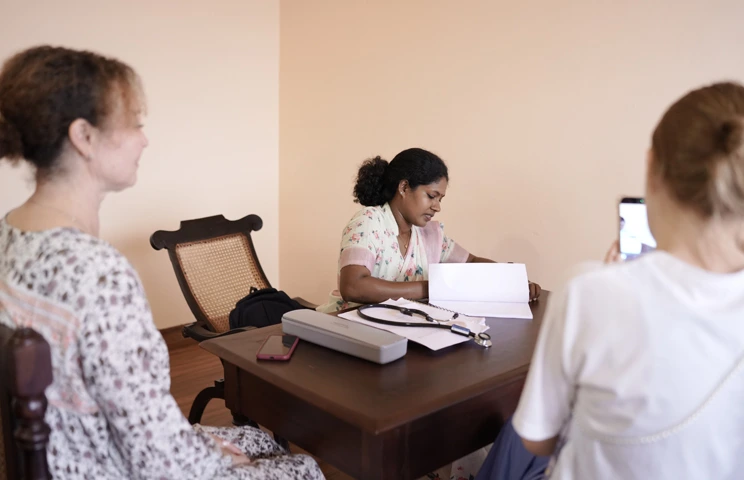 Ayurveda physician in consultation with guests