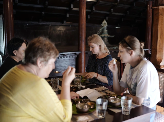 Guests sharing a Satvik meal